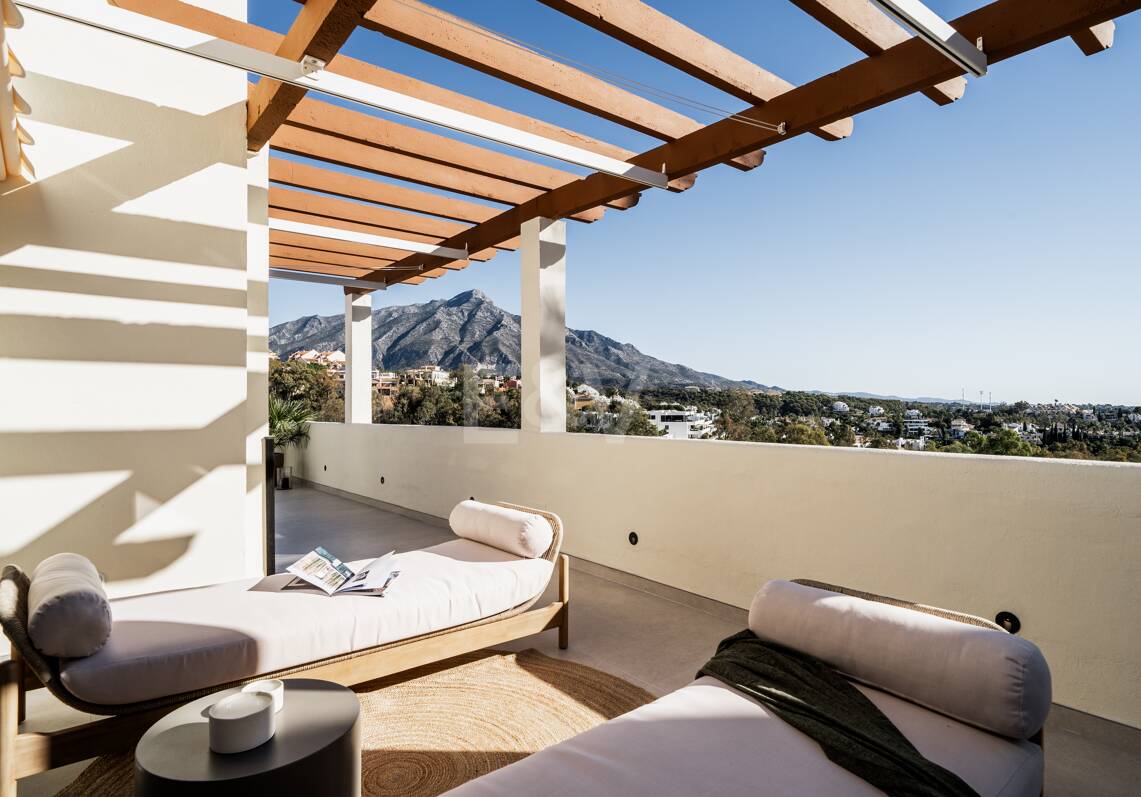 Elegant duplex penthouse in La Cerquilla with spectacular mountain views