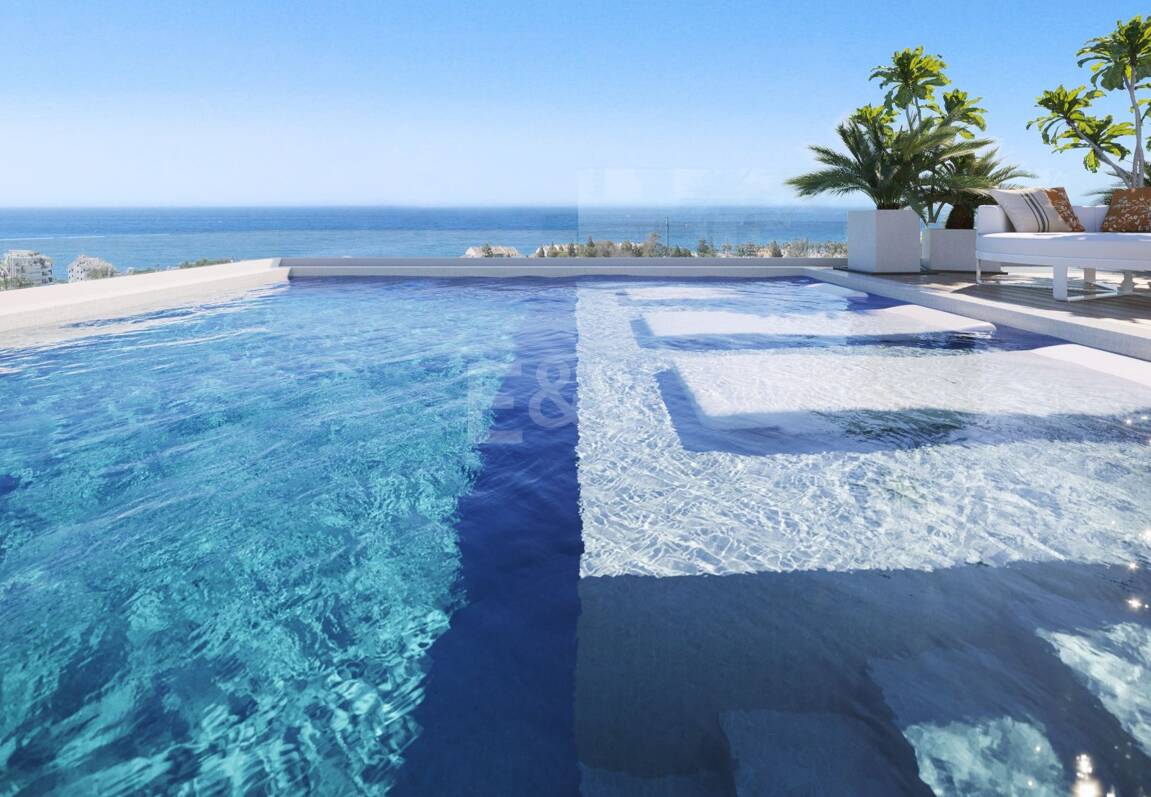 An Exceptional Duplex Penthouse with Sweeping Views Moments from the Beach