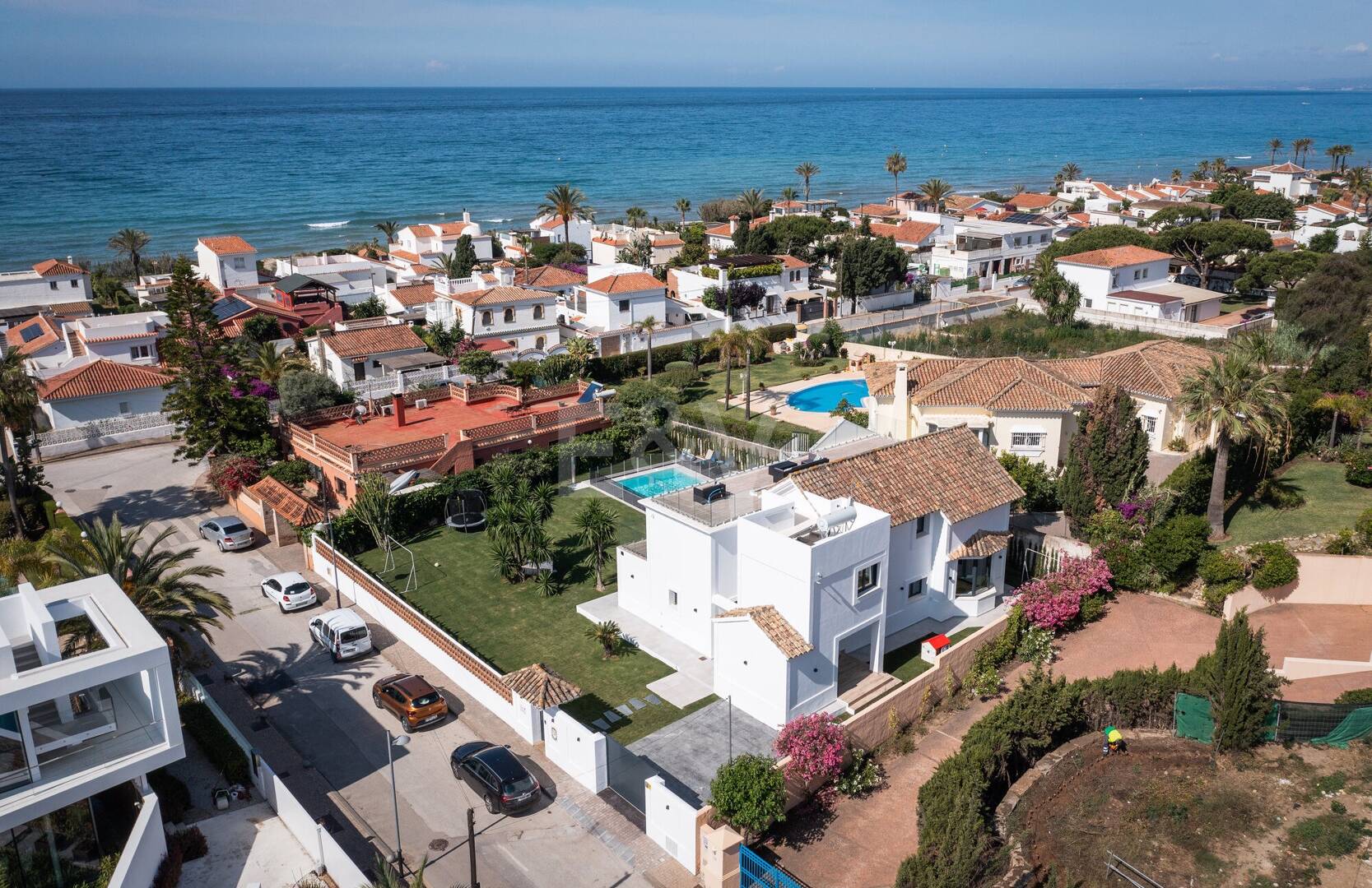 Contemporary Beachfront Villa in Marbella East: Perfect Family Getaway Steps from Elviria 's Best Beach