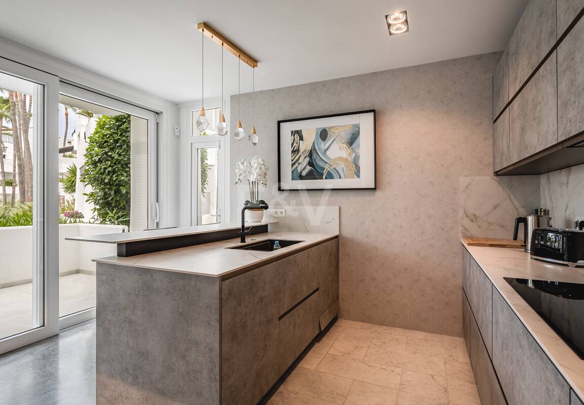 Impeccable Southwest-Facing Garden Apartment in Marina Puente Romano