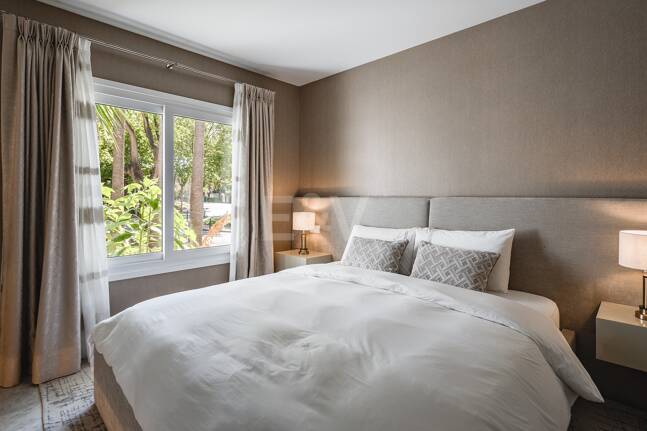 Impeccable Southwest-Facing Garden Apartment in Marina Puente Romano