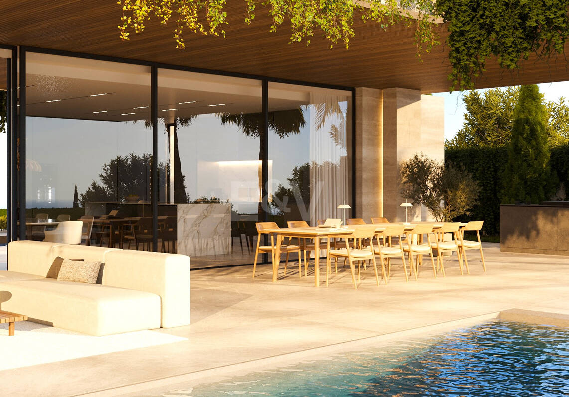 Villa de lujo moderno con vistas panorámicas al mar en una comunidad cerrada