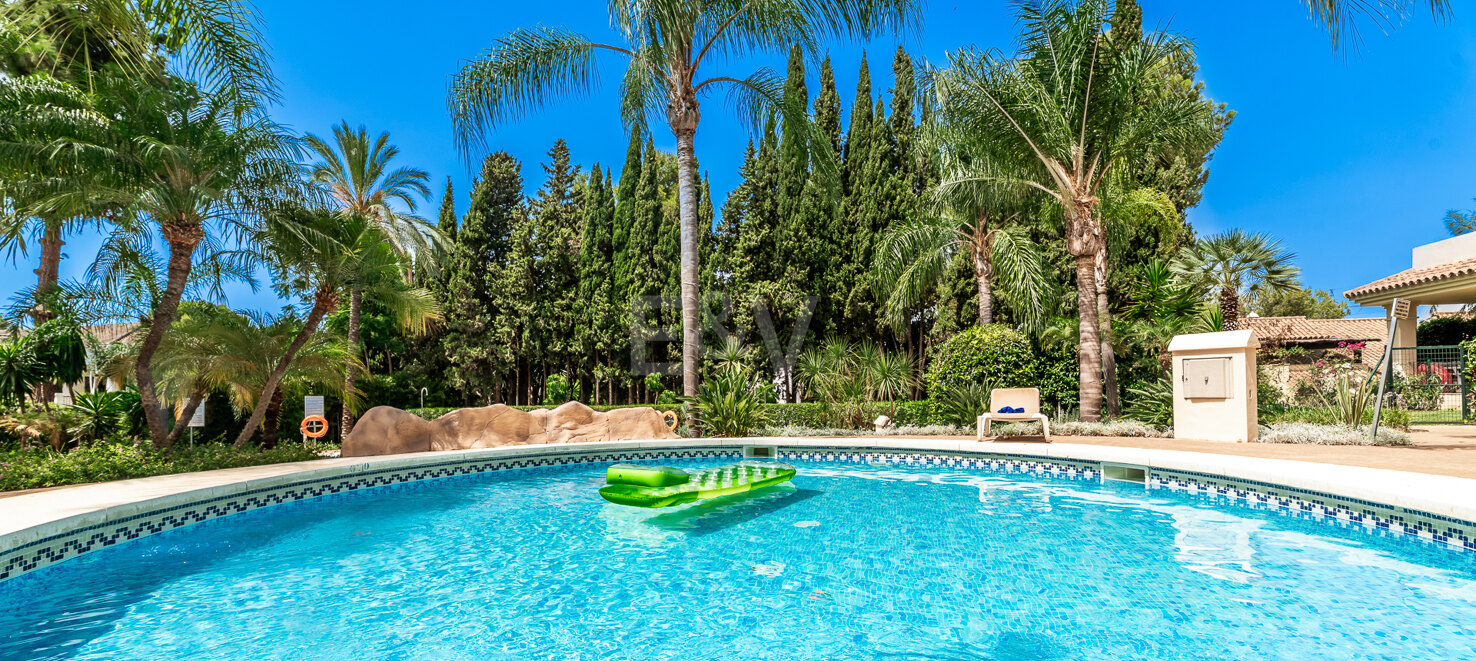 Charming Garden Apartment with Direct Pool Access in Gated Community