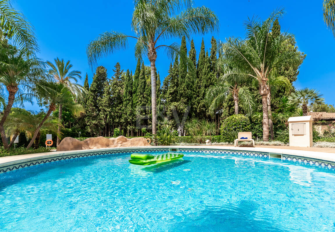 Charming Garden Apartment with Direct Pool Access in Gated Community