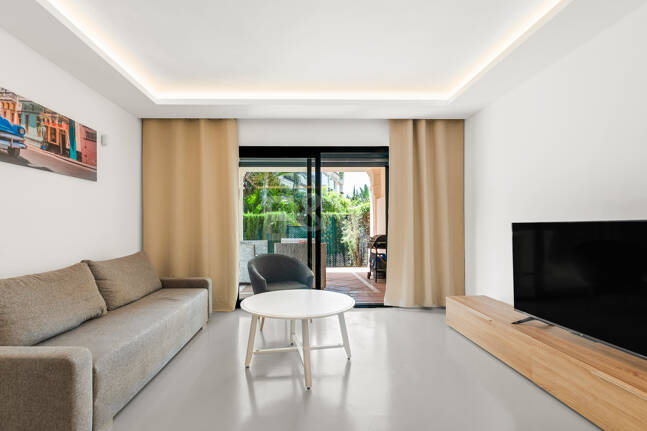 Charming Garden Apartment with Direct Pool Access in Gated Community