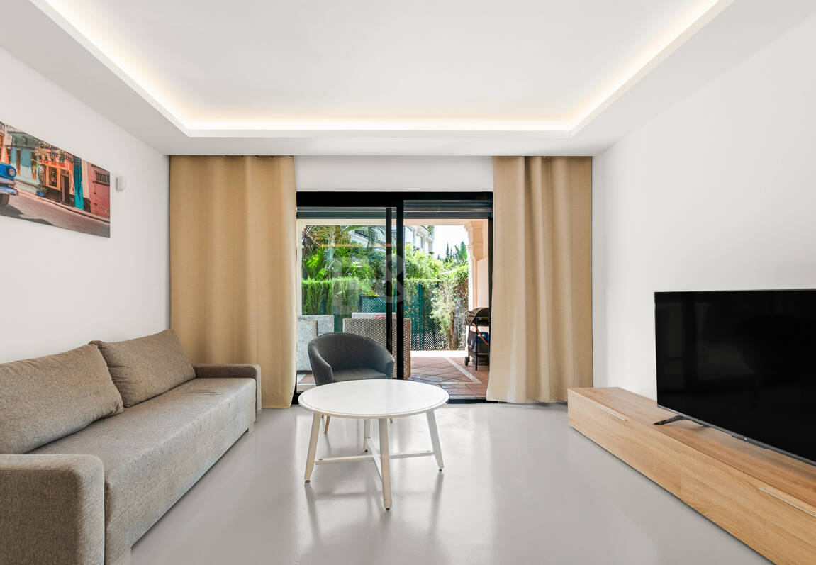 Charming Garden Apartment with Direct Pool Access in Gated Community