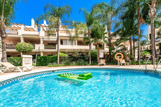 Charming Garden Apartment with Direct Pool Access in Gated Community