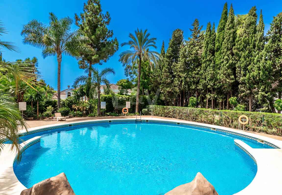 Charming Garden Apartment with Direct Pool Access in Gated Community