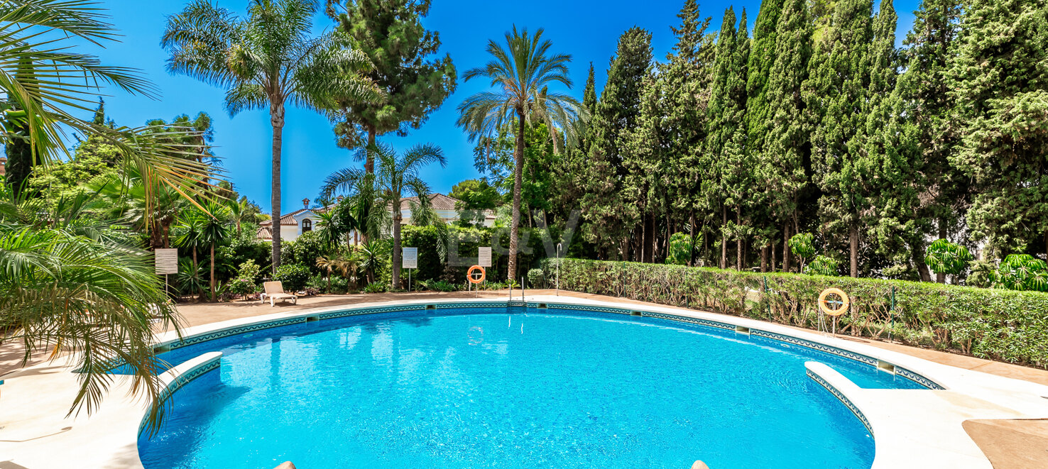 Charming Garden Apartment with Direct Pool Access in Gated Community