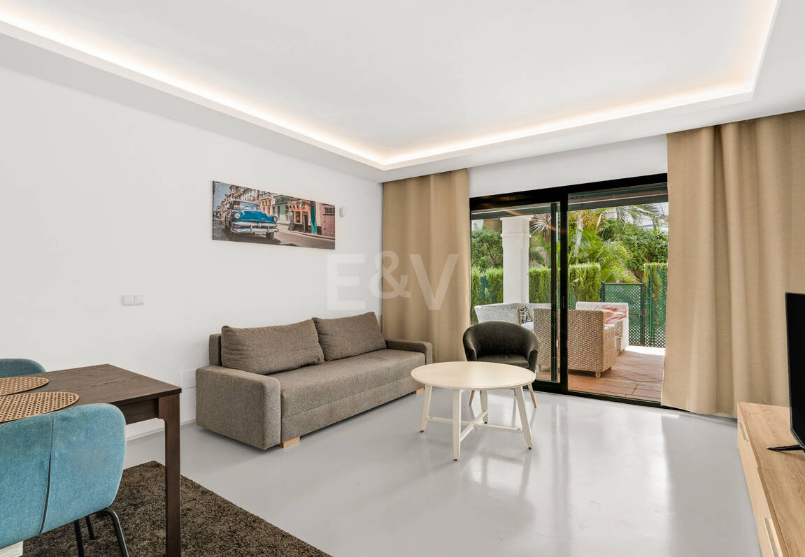 Charming Garden Apartment with Direct Pool Access in Gated Community