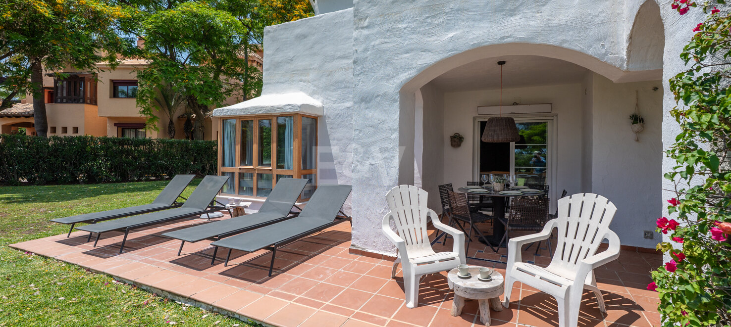 Beachfront Corner Apartment with Expansive Garden in Premier Gated Community