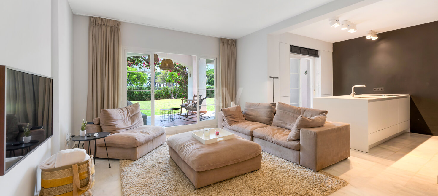 Beachfront Corner Apartment with Expansive Garden in Premier Gated Community