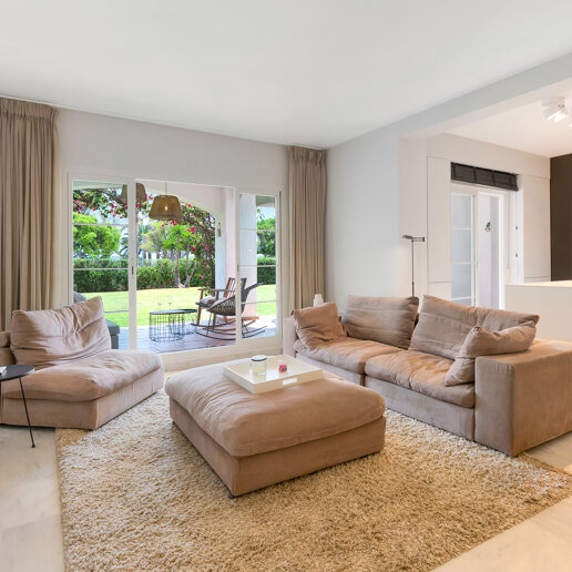 Beachfront Corner Apartment with Expansive Garden in Premier Gated Community