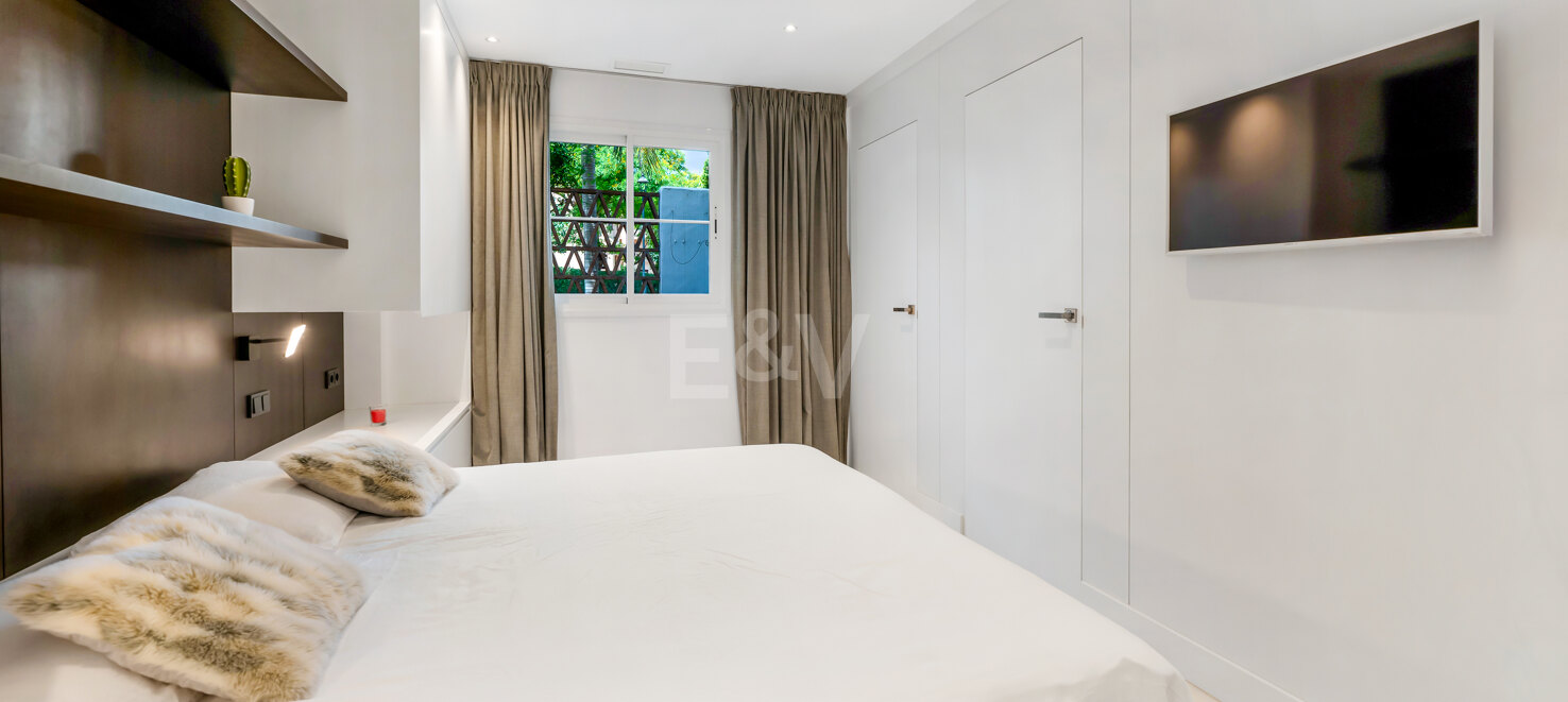 Beachfront Corner Apartment with Expansive Garden in Premier Gated Community