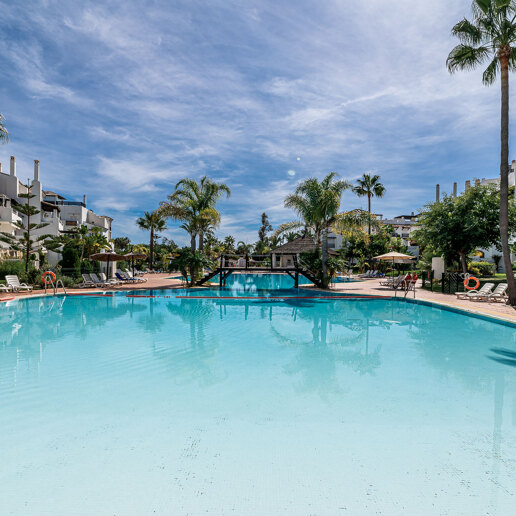 Beachfront Corner Apartment with Expansive Garden in Premier Gated Community