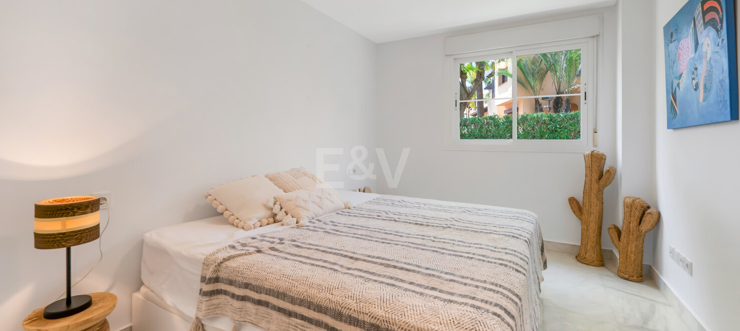 Beachfront Corner Apartment with Expansive Garden in Premier Gated Community