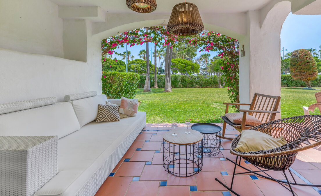 Beachfront Corner Apartment with Expansive Garden in Premier Gated Community