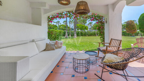 Beachfront Corner Apartment with Expansive Garden in Premier Gated Community