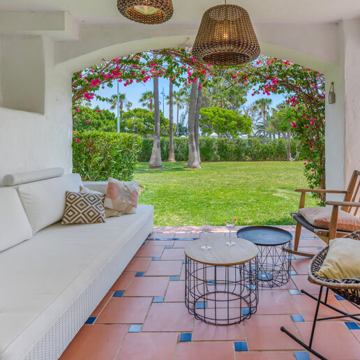 Beachfront Corner Apartment with Expansive Garden in Premier Gated Community