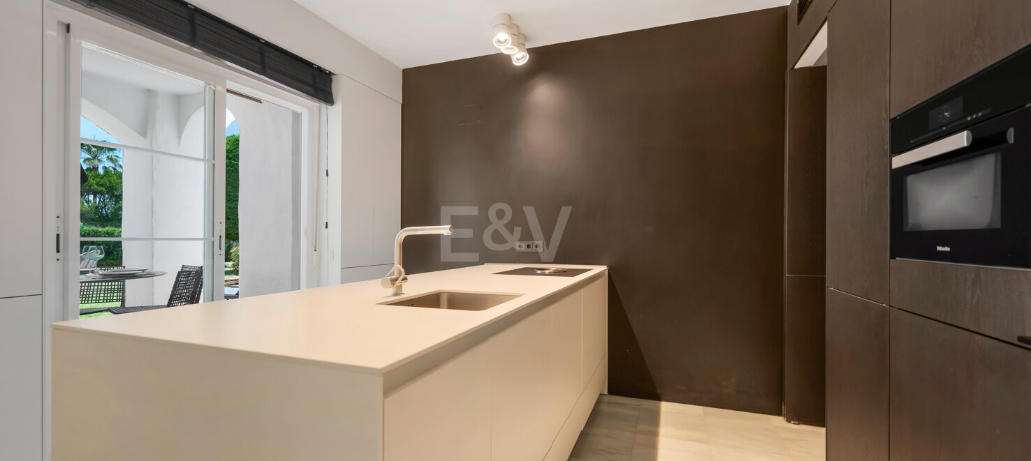 Beachfront Corner Apartment with Expansive Garden in Premier Gated Community