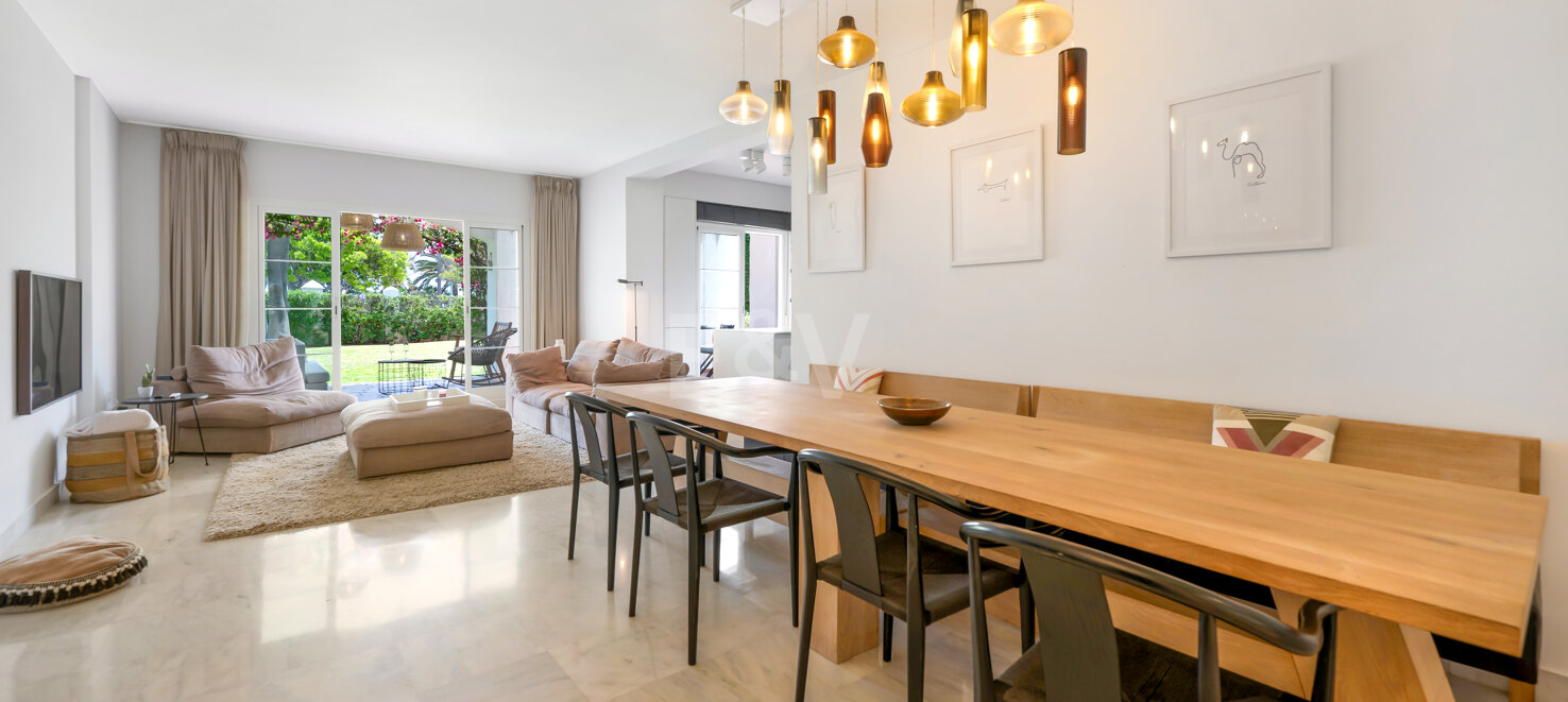 Beachfront Corner Apartment with Expansive Garden in Premier Gated Community