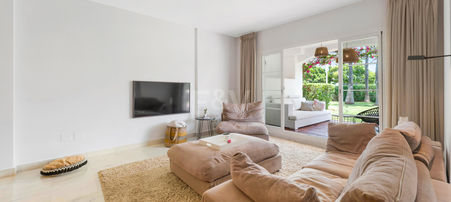 Beachfront Corner Apartment with Expansive Garden in Premier Gated Community