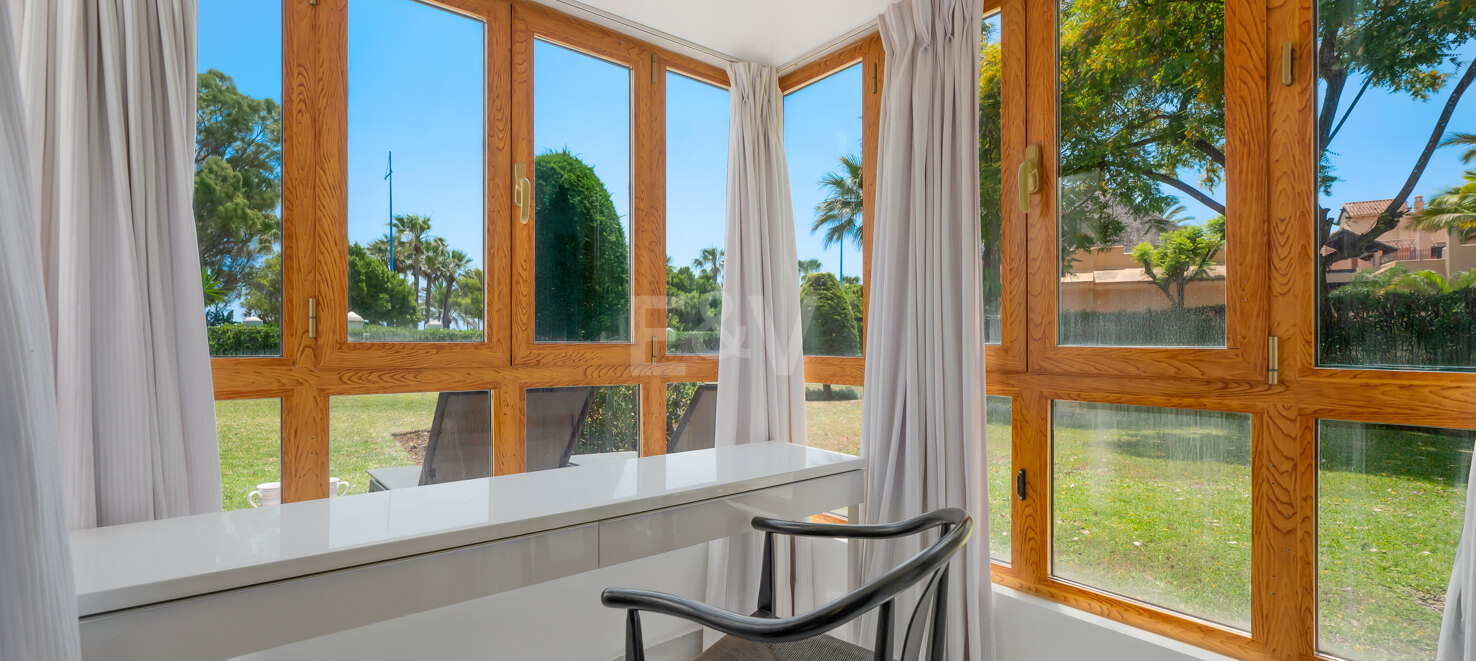 Beachfront Corner Apartment with Expansive Garden in Premier Gated Community