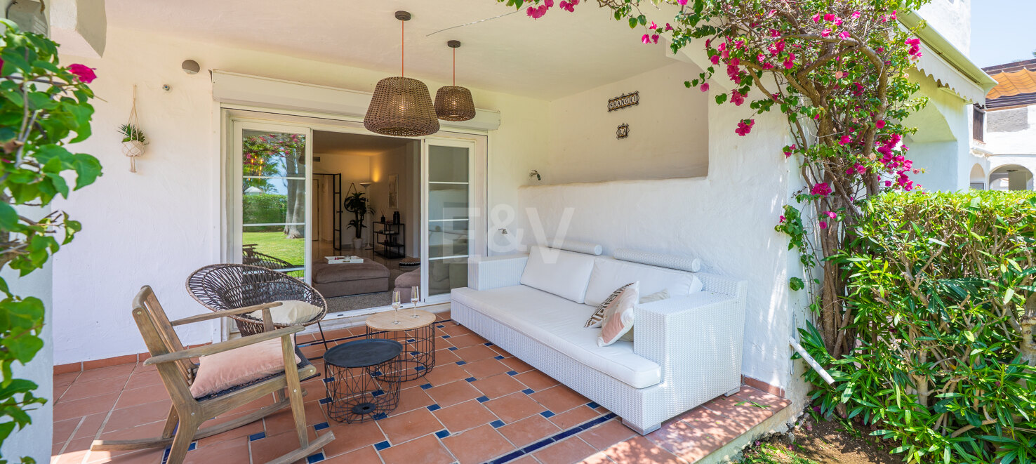 Beachfront Corner Apartment with Expansive Garden in Premier Gated Community