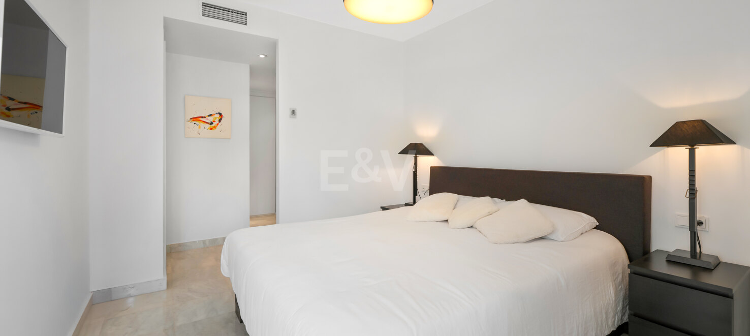 Beachfront Corner Apartment with Expansive Garden in Premier Gated Community