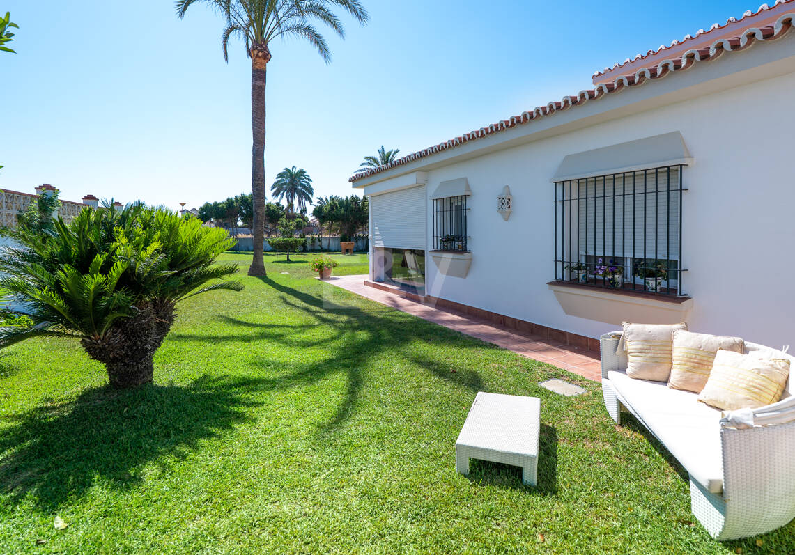 Coastal Charm: Seafront Villa with Stunning Views and Lush Gardens, All on a Single Level