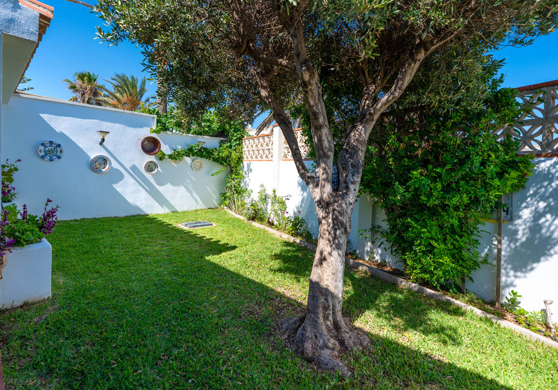 Coastal Charm: Seafront Villa with Stunning Views and Lush Gardens, All on a Single Level