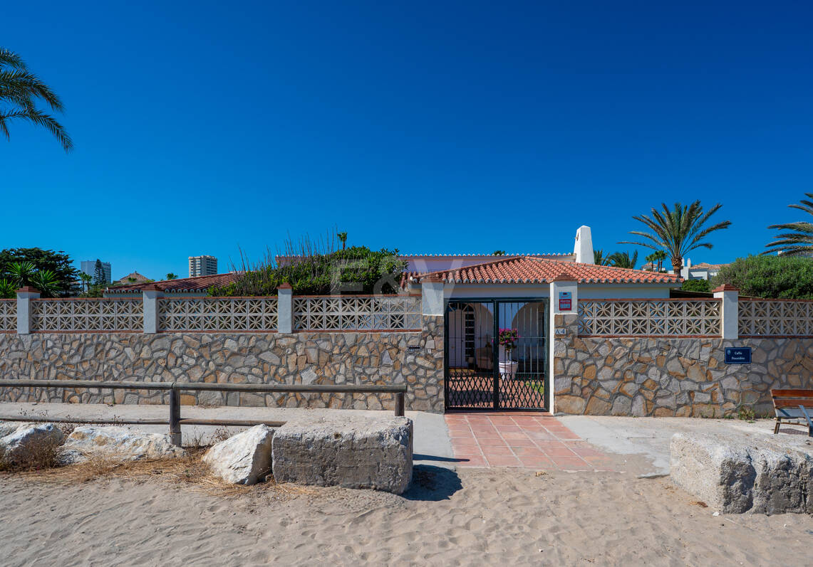 Coastal Charm: Seafront Villa with Stunning Views and Lush Gardens, All on a Single Level