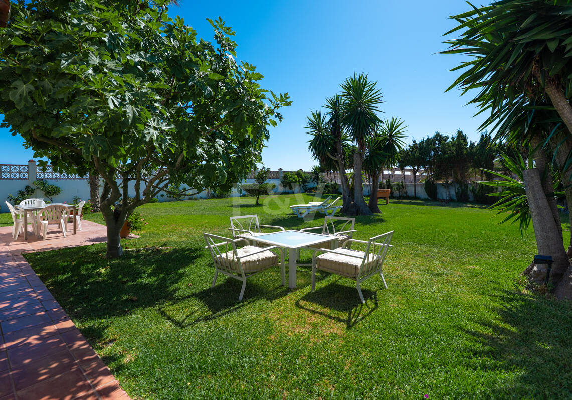 Coastal Charm: Seafront Villa with Stunning Views and Lush Gardens, All on a Single Level