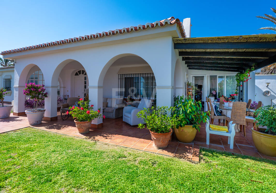 Coastal Charm: Seafront Villa with Stunning Views and Lush Gardens, All on a Single Level