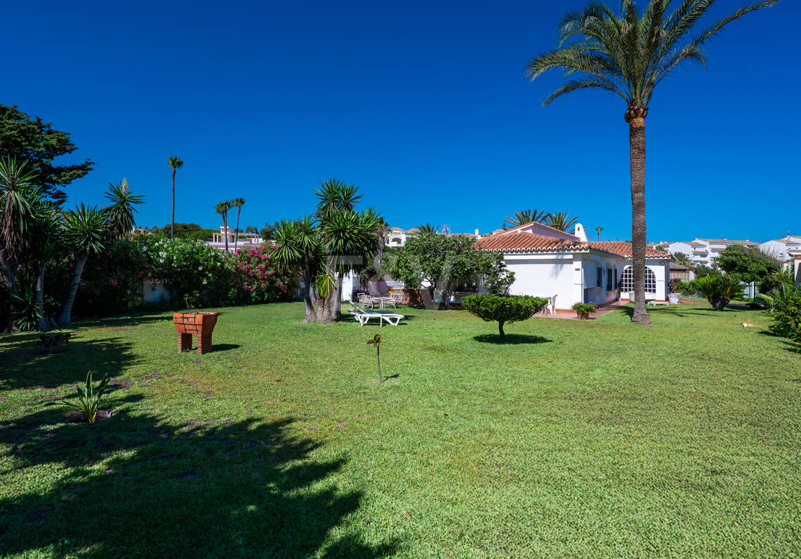 Coastal Charm: Seafront Villa with Stunning Views and Lush Gardens, All on a Single Level
