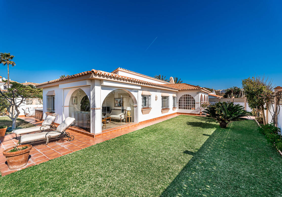 Coastal Charm: Seafront Villa with Stunning Views and Lush Gardens, All on a Single Level