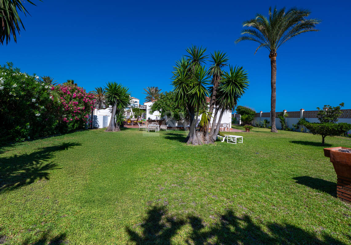 Coastal Charm: Seafront Villa with Stunning Views and Lush Gardens, All on a Single Level
