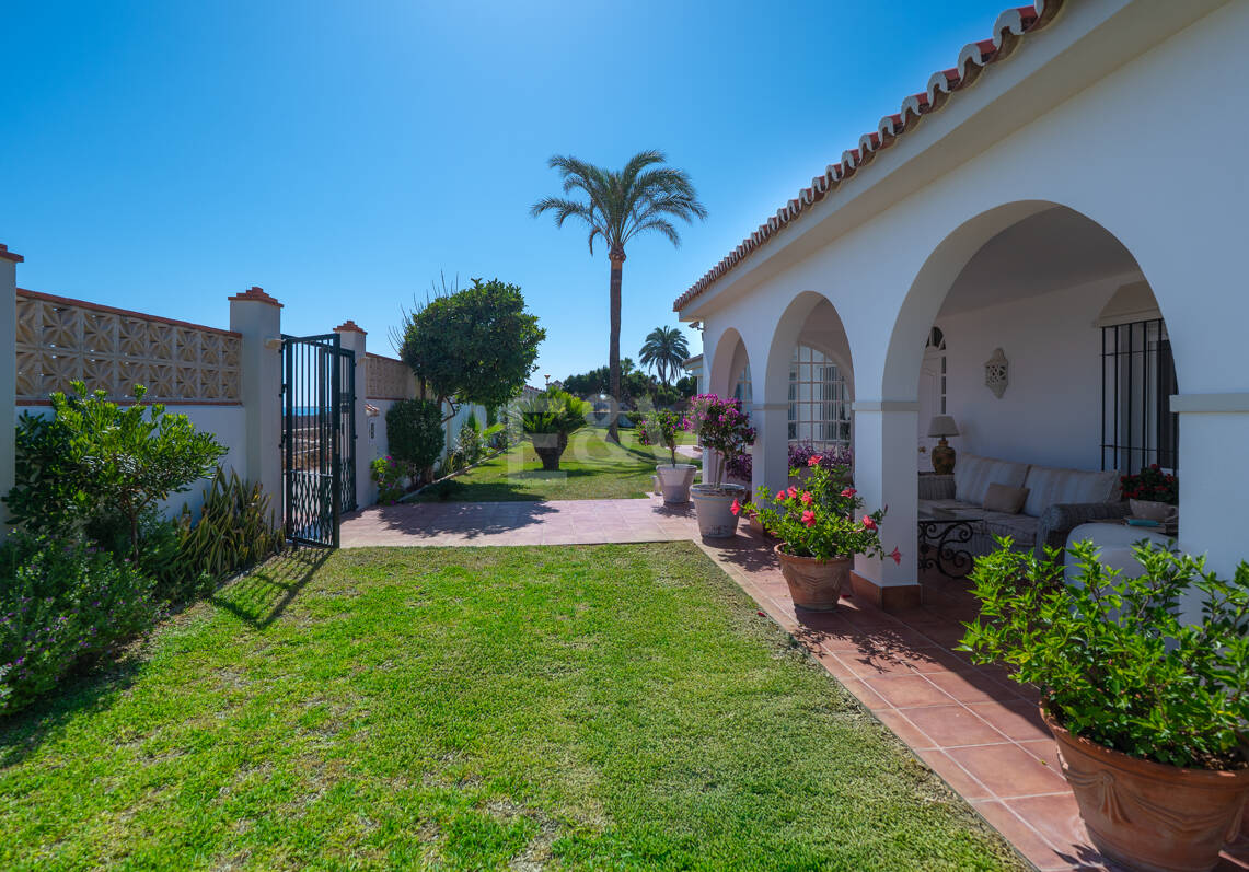 Coastal Charm: Seafront Villa with Stunning Views and Lush Gardens, All on a Single Level