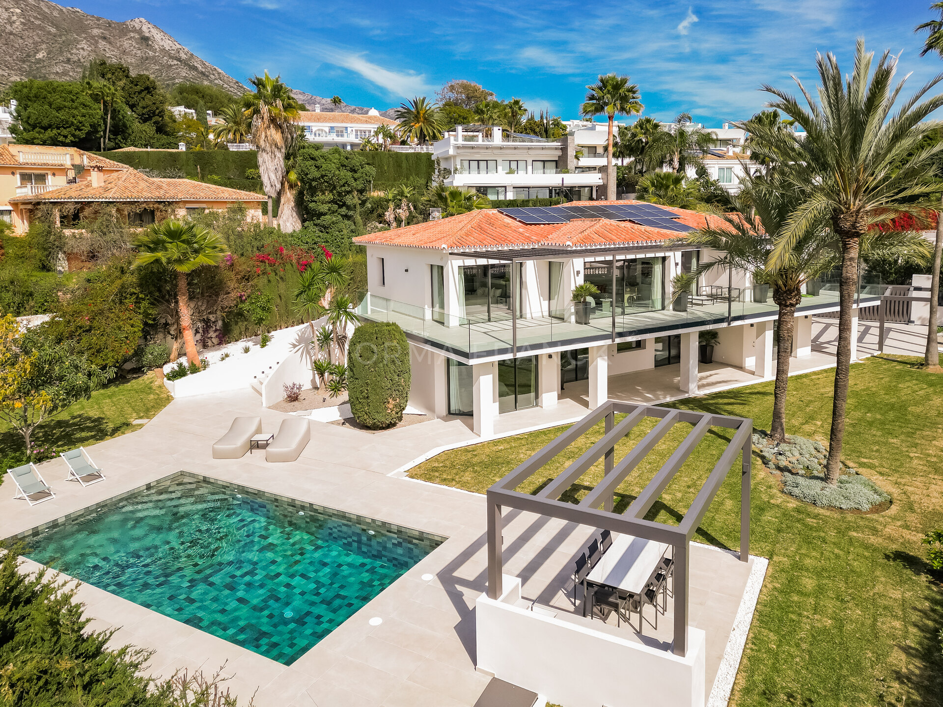 African View - Set in Nagüeles, moments from Marbella’s Golden Mile, this villa offers open views to the Mediterranean