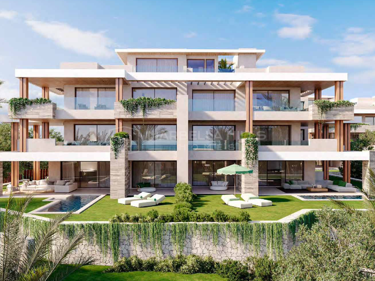 Erdgeschosswohnungen in erster Strandlinie zum Verkauf in Estepona mit privatem Garten und Meerblick