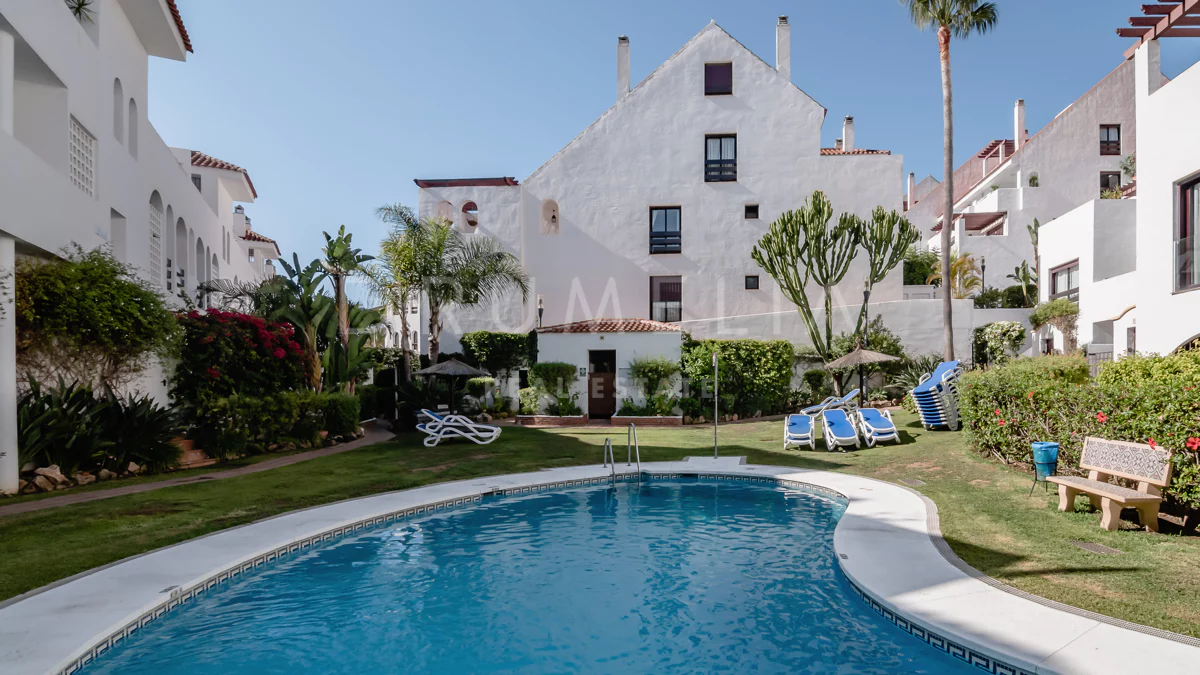 View of A Scandinavian Penthouse Apartment With A Dark Green Kitchen