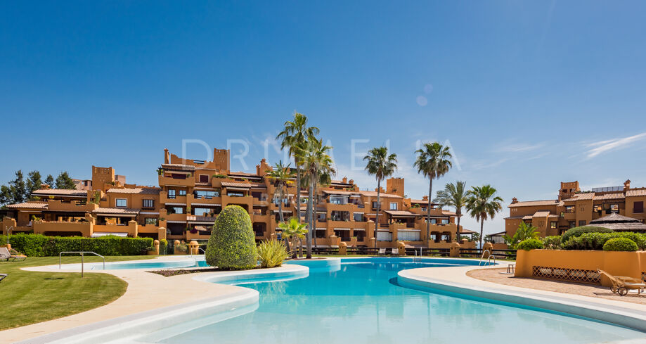Luxury sea-view apartment in Los Granados del Mar with terrace, designer kitchen & top amenities.