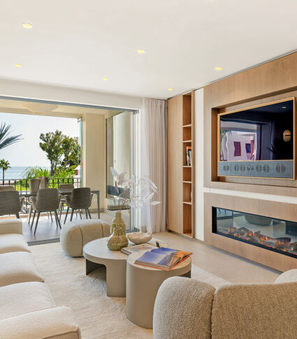 Stylishly renovated beachfront apartment in Bahía del Velerín with luxury features and sea views.