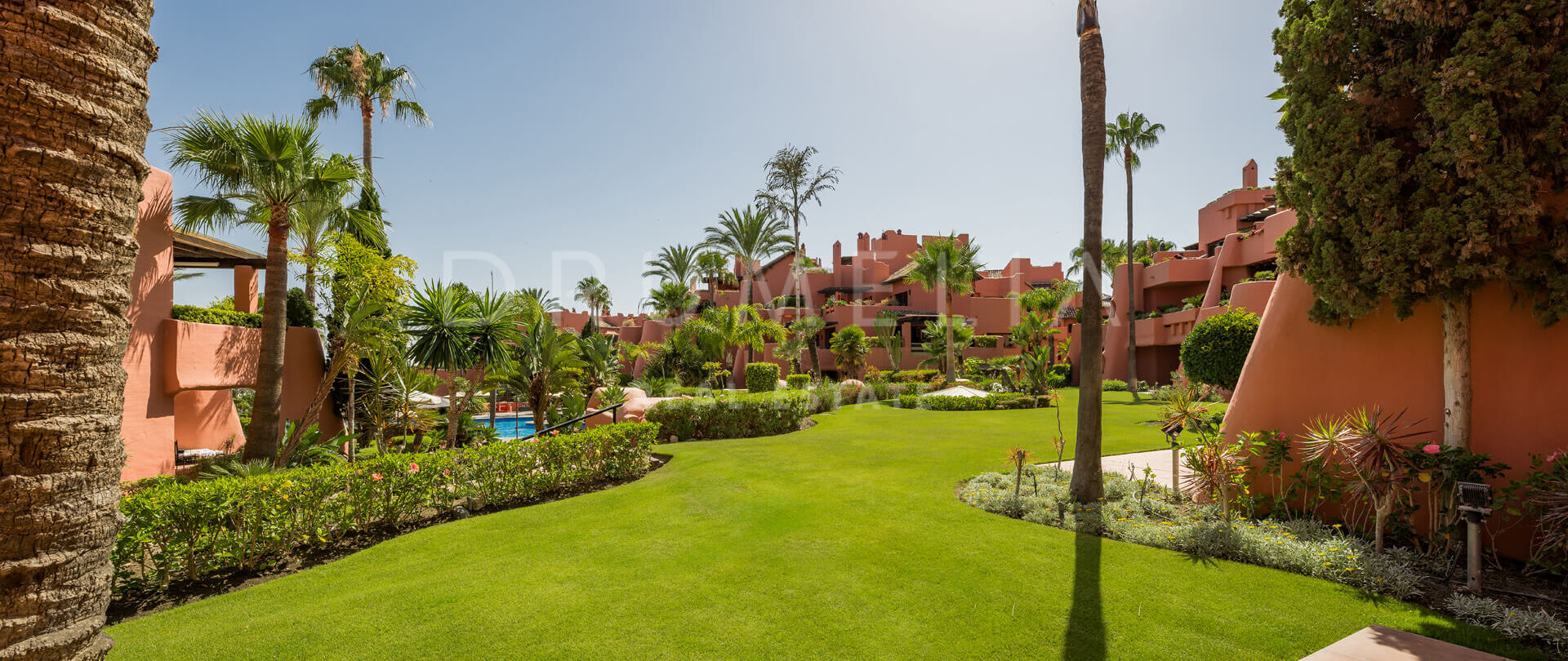 Renovated beachfront apartment in Torre Bermeja with garden views, terrace, and top amenities.