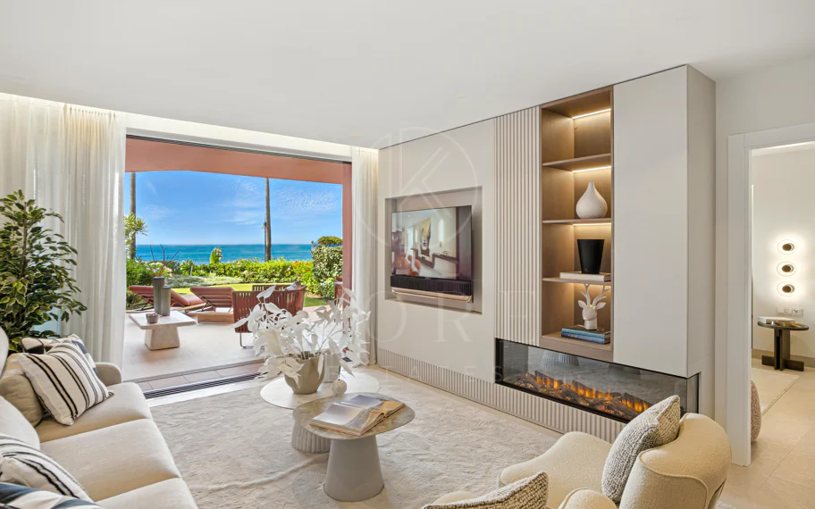 Impeccably renovated, south facing beach front, garden apartment located in the exclusive Menara Beach community on the sought-after New Golden Mile