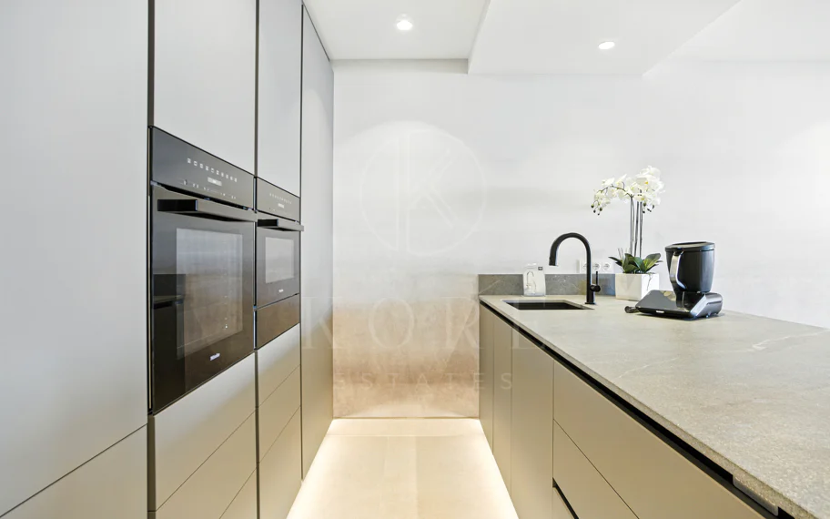 Impeccably renovated, south facing beach front, garden apartment located in the exclusive Menara Beach community on the sought-after New Golden Mile
