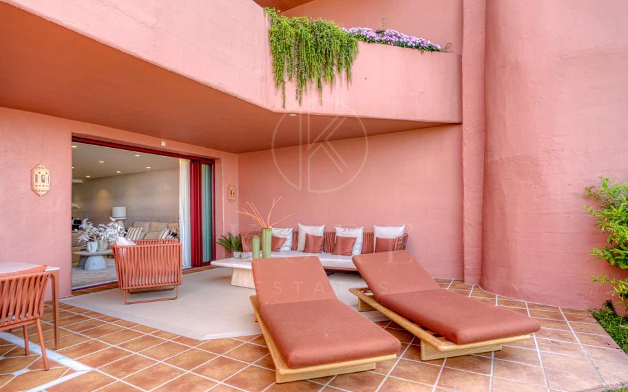 Impeccably renovated, south facing beach front, garden apartment located in the exclusive Menara Beach community on the sought-after New Golden Mile
