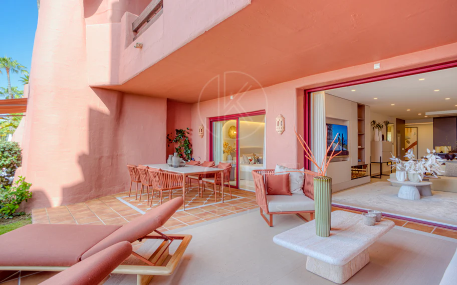 Impeccably renovated, south facing beach front, garden apartment located in the exclusive Menara Beach community on the sought-after New Golden Mile