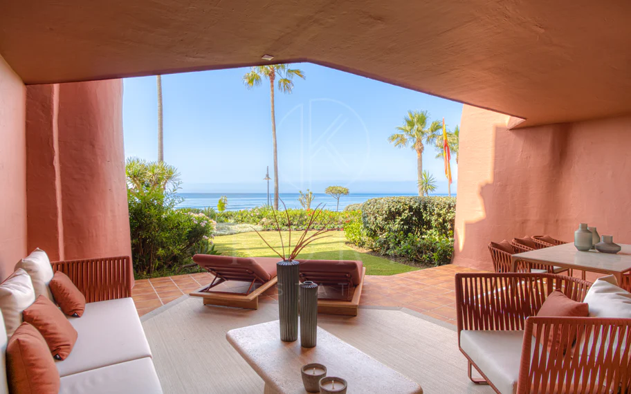 Impeccably renovated, south facing beach front, garden apartment located in the exclusive Menara Beach community on the sought-after New Golden Mile