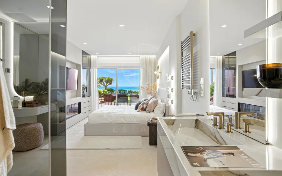 Impeccably renovated, south facing beach front, garden apartment located in the exclusive Menara Beach community on the sought-after New Golden Mile